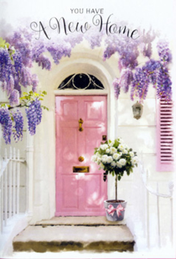 At a peaceful doorway in Acton, the feeling of a fresh chapter is caught in a single, gentle composition. A pastel pink front door, painted in a soft, milky blush, stands firmly at the centre, its surface catching slanting light in a way that makes the colour glow without shouting. Above it, wisteria falls in cascades of lavender and lilac, the blooms massed in loose, drooping clusters that drape from a sturdy vine. They form a natural arch around the door, like a floral curtain swaying lightly in an imagined breeze, lending the entrance the charm of an older Acton side street tucked away from the main road. The surrounding wall is whitewashed and simple, its modest texture adding to the sense of calm and cleanliness, while a matching shutter, washed in the same blush tone, hints at the rooms and stories within. At the threshold, perfectly placed on the step, sits a metal bucket in a muted grey, its utilitarian lines softened by what it holds: a lush bouquet of white and creamy roses. The blossoms are tightly packed yet still airy, the outer petals curling gently away from the centres, each bloom at its prime. Wisps of fresh green foliage weave through the roses, suggesting movement and life. Around the base of the bucket, a pink ribbon is tied in a neat yet relaxed bow, tying together the gentle pastels of door, shutter, and flowers. The mood is quiet but undeniable celebration, perfectly suited to a housewarming gift delivered to a new address in Acton, evoking hope, gratitude, and the comforting thought that this space is ready to become home.